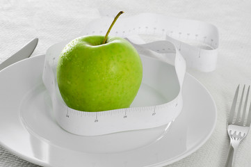 apple and measuring tape