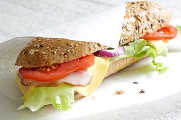 Sandwich on white paper