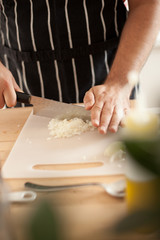 Obraz na płótnie Canvas chef chopping the onion