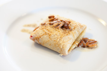 Pancake with pine nuts