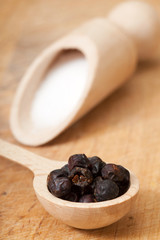 salt and allspice on the wooden table