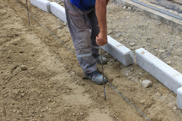 builder worke with Measuring Tape