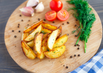 Fried potato wedges with cherry tomato