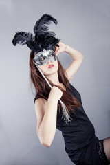 beautiful young girl with venetian mask