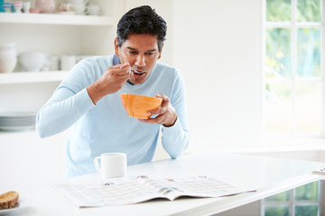 Indian Man Enjoying Breakfast At Home