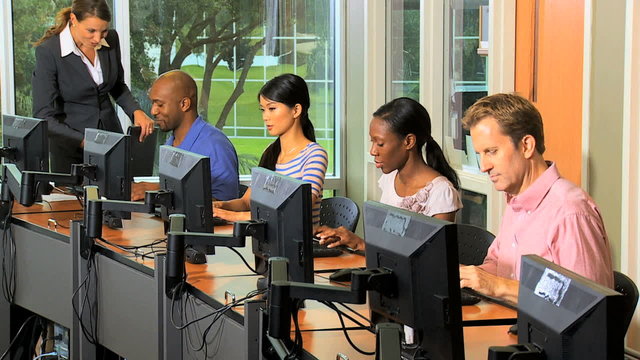 IT College Students Working with Tutor