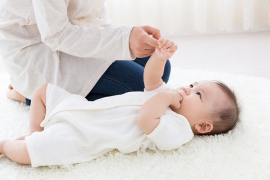 asian baby on the white carpet