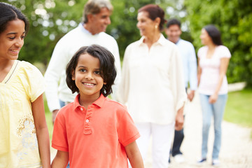 Muti-Generation Indian Family Walking In Countryside