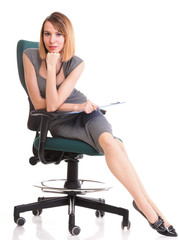 Fototapeta premium young business woman sitting with her clipboard isolated