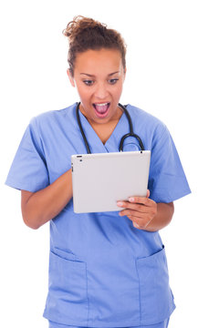 Young Doctor With Stethoscope And Tablet Isolated On White Backg