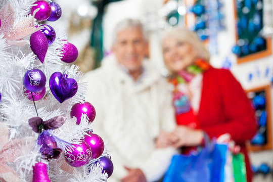 Decorated Christmas Tree With Couple In Store