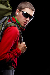 young man with backpack walking