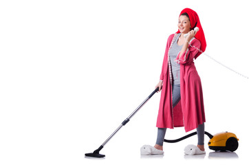 Housewife with vacuum cleaner on white