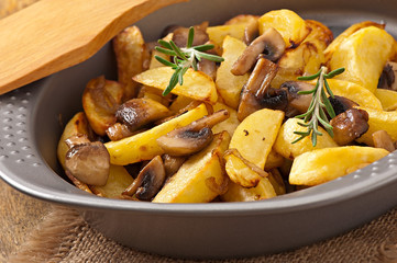 Fried potatoes with mushrooms and onions