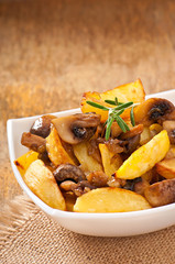 Fried potatoes with mushrooms and onions