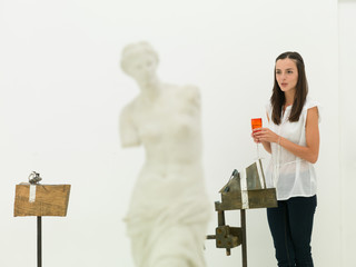 female curator at exhibition opening