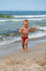 cute boy having fun on beach