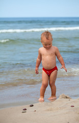 cute boy having fun on beach