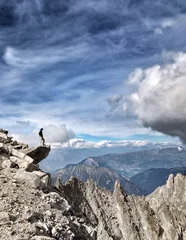 Foto op Canvas Man on edge of a mountain © Morgan