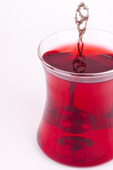 a glass of black tea