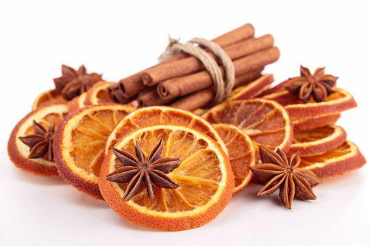 isolated dried orange slices and cinnamon