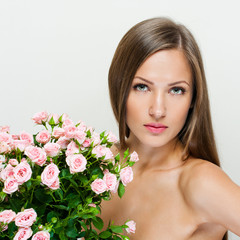  woman with beautiful face and pink flowers