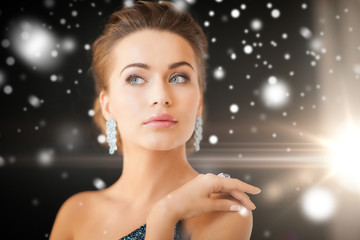 woman with diamond earrings