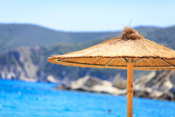 Close-up view of a straw beach umbrella
