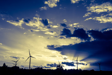 wind turbines at sunset
