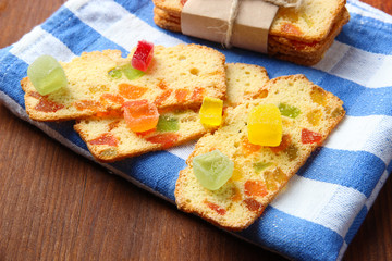 Biscotti with candied fruits, on wooden background