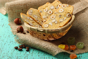 Biscotti with hazelnuts, on wooden background