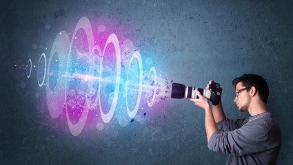 Photographer making photos with powerful light beam
