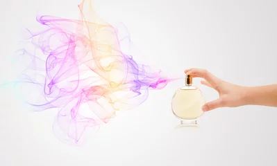 Deurstickers woman hands spraying perfume © ra2 studio