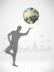 man in full body suit holding planet earth