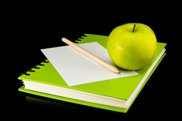 Green book,apple,paper card and pencil