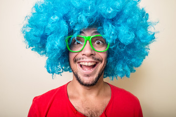 crazy funny young man with blue wig