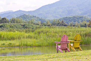 A pair of chairs with mountain view