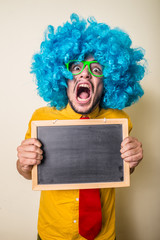 crazy funny young man with blue wig