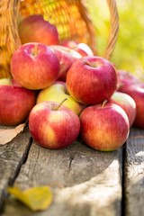 Red apples on wooden table