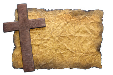 Wooden cross on old paper
