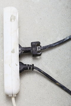 electrical cords connected to power strip building site