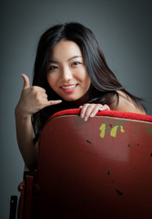 Attractive Asian girl 20s at the theatre isolate white backgroun