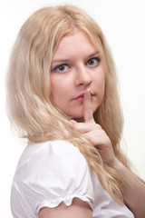 Naklejka premium Young girl asking for silence
