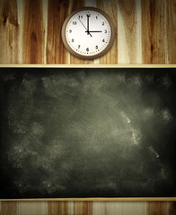 Chalkboard and clock on wall