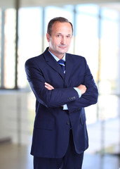 Portrait of a happy senior business man smiling