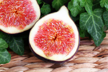 Ripe figs in leaves close-up