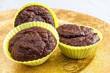Three chocolate muffins