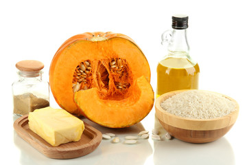 Cut pumpkin with ingredients for cooking isolated on white