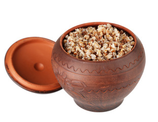Buckwheat in pot isolated on white