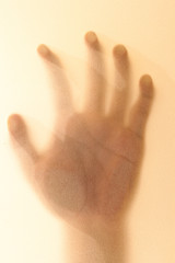 scary palm of hand behind mirror in the bathroom..